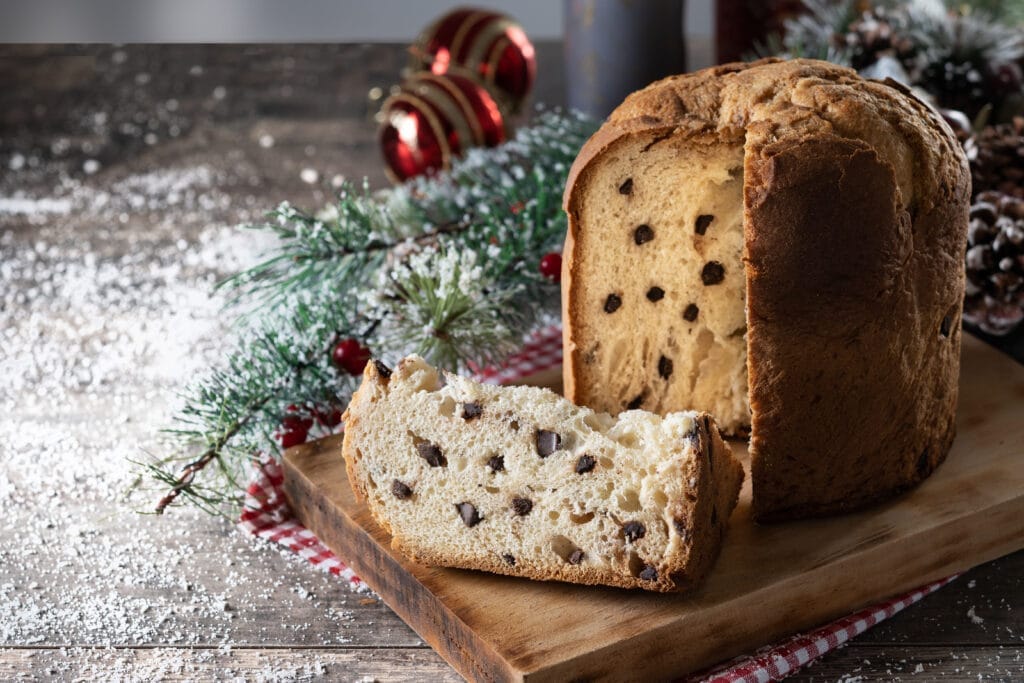 Baking Story|Italian Christmas Bread Panettone 9 traditional christmas panettone with red tie christmas ornaments wooden table